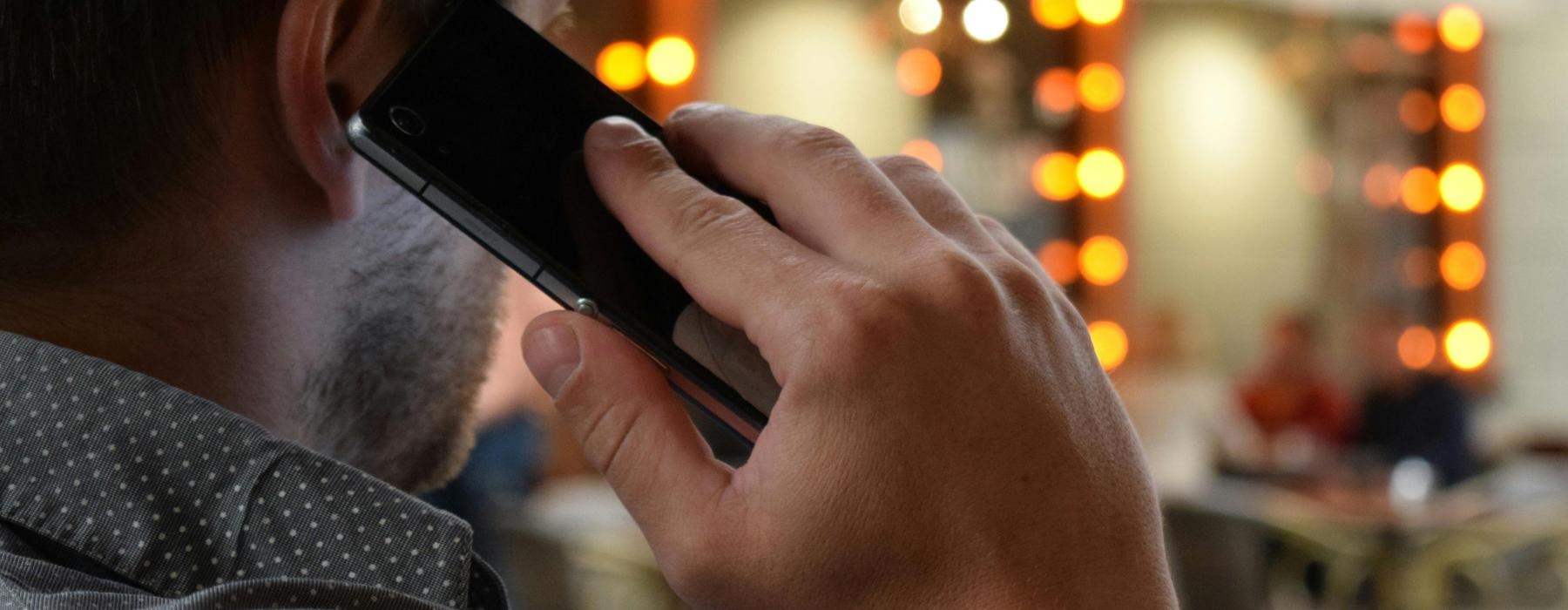 a man holding a phone