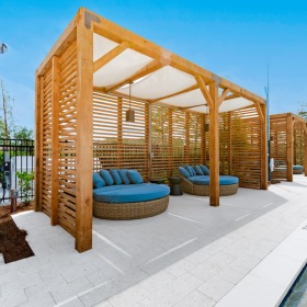 poolside cabanas with blue cushions