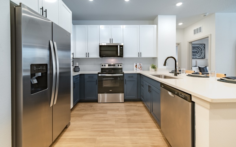 Image of Kitchen with Stainless Steel Appliances, Quartz Counters and Dual Tone Cabinetry