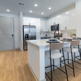 a kitchen with white cabinets